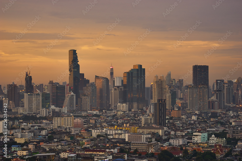 scenic of golden skyline with cityscape on sunset time