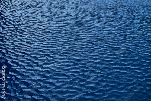 texture of navy blue ripple on swimming pool