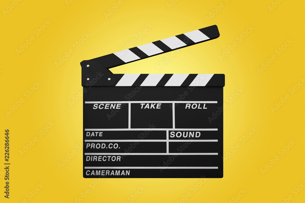 clapperboard isolated on yellow