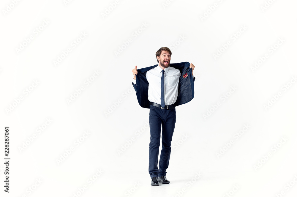 a man in a suit takes off his jacket a man in a suit takes off his jacket