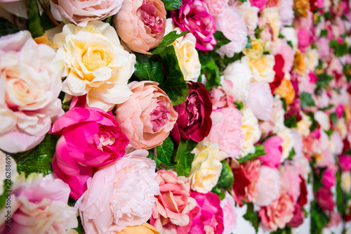 wedding decoration - close up of colorful artificial flowers wall