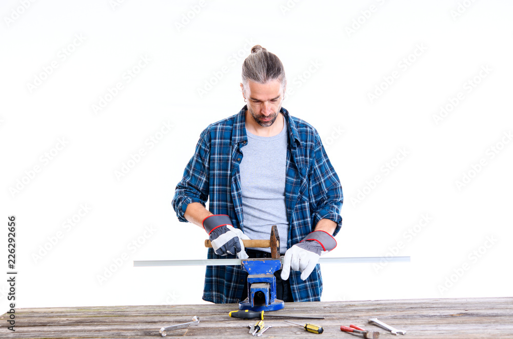 worker in blue shirt working with metal worker in blue shirt working with metal