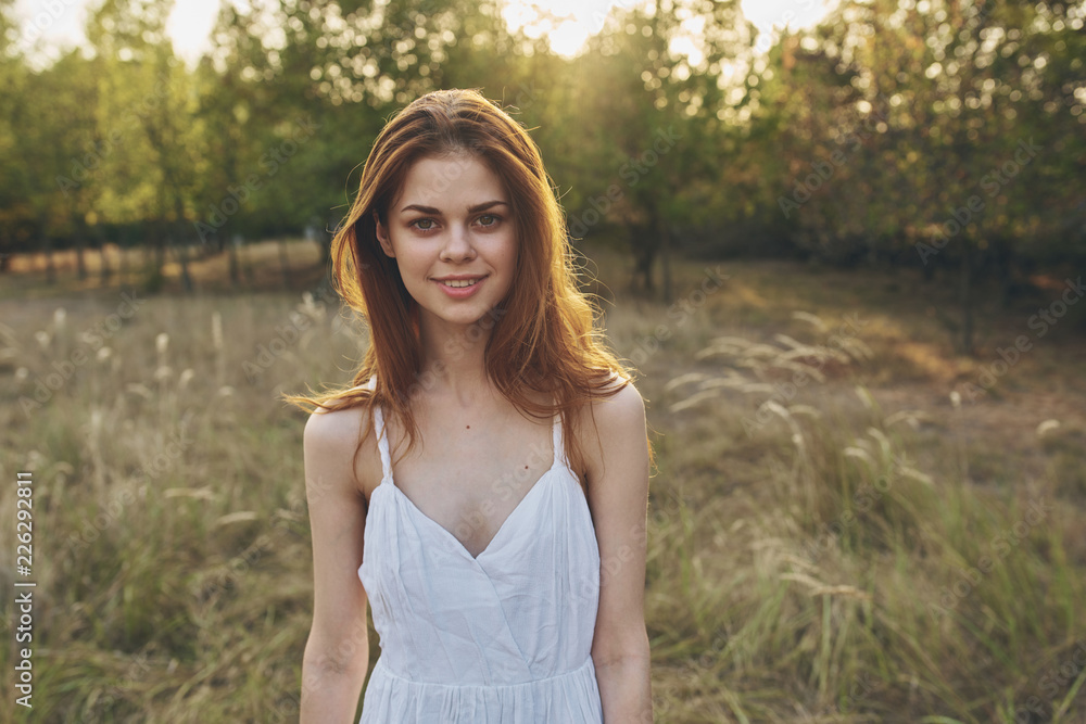 pretty woman in white dress on nature background