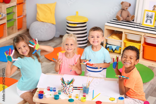 Cute children painting with...