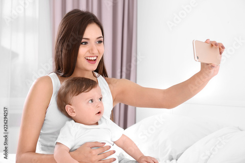 Happy young mother with her...