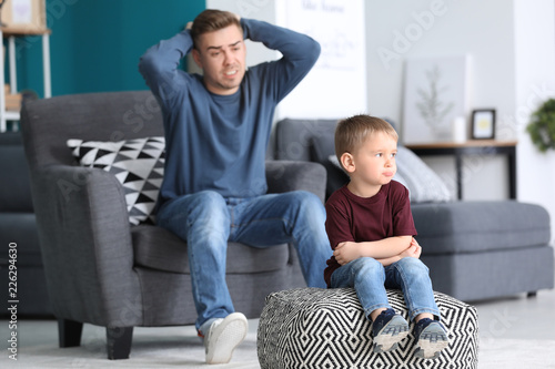 Father scolding his little ...