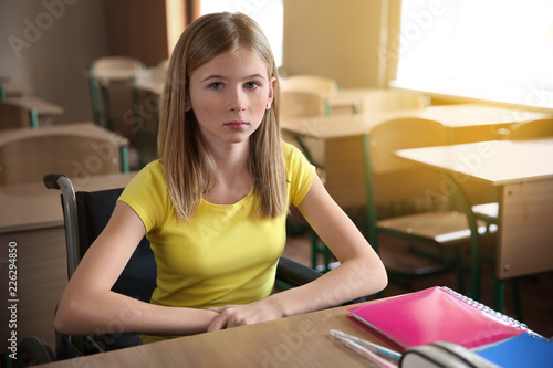 Sad teenage girl in wheelch...