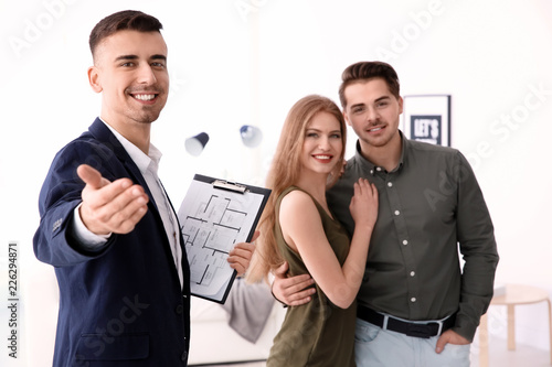 Real estate agent with clie...