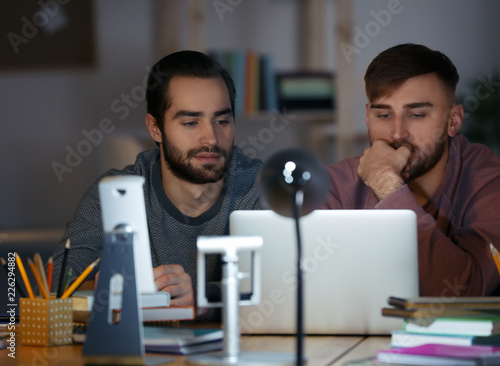 Students doing homework tog...