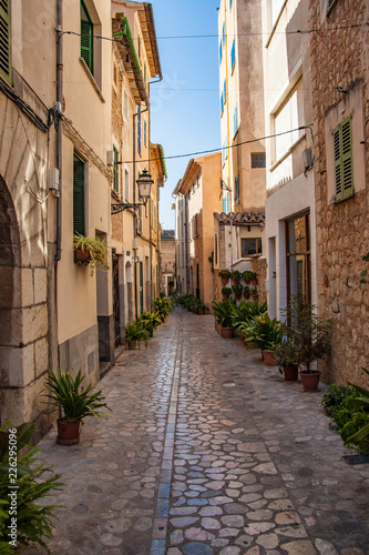Pictoresque mediterranean street in Soller. Port de Soller  is a village and the port of the town of Soller  in Mallorca  in the Balearic Islands  Spain.