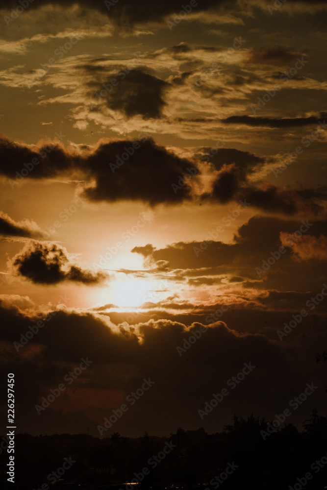 Fototapeta premium Dusk til dawn | Sunset sky on the beach | Sun with dark clouds