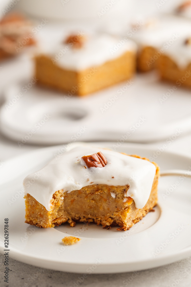 Vegan carrot cake with coconut cream and pecan, plant based diet concept. Vegan carrot cake with coconut cream and pecan, plant based diet concept.