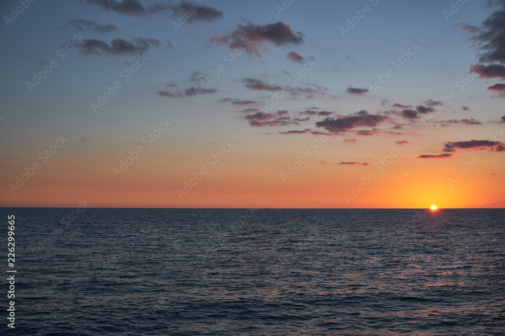 Beautiful sunset with clouds over the sea. Outdoor recreation. Non-urban scene. Travel destination.