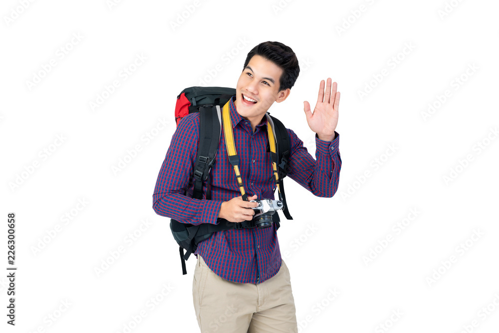 Portrait of a young happy Asian traveler smiling and waving hand