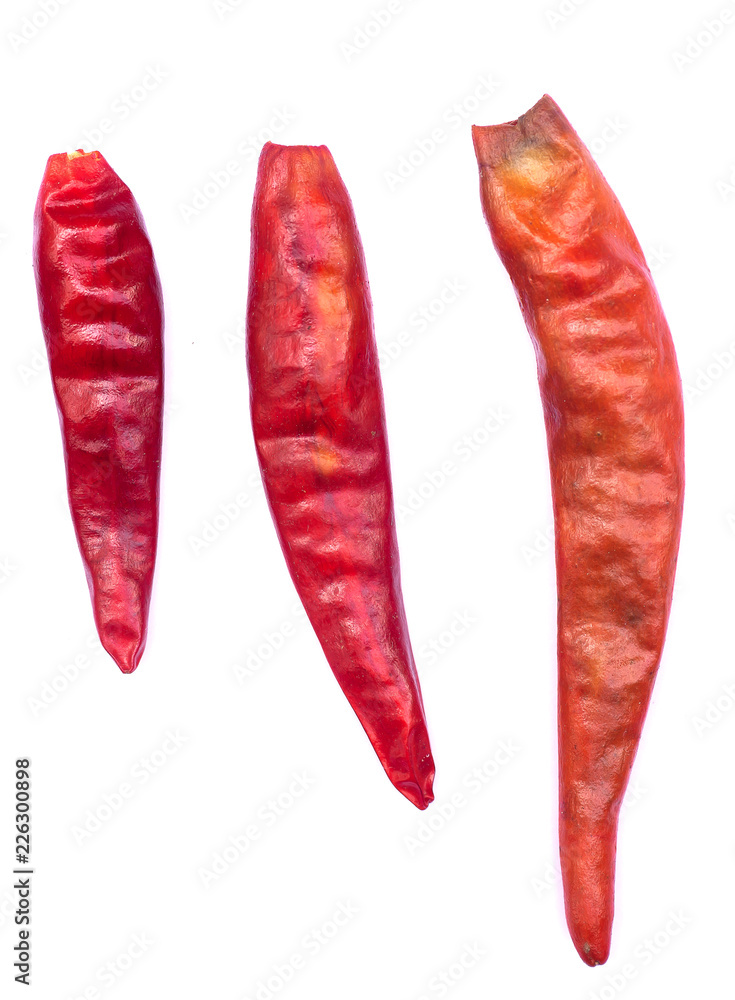 Close up of red dried chilli for food ingredient isolated on white background Close up of red dried chilli for food ingredient isolated on white background