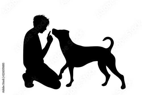 Vector silhouette of man with dog white background.