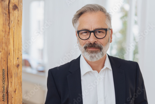 Elegant mature bearded man with glasses