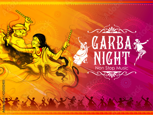 Couple playing Dandiya in disco Garba Night poster for Navratri Dussehra festival of India photo