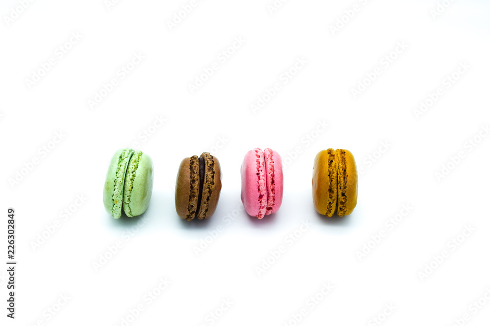 macarons isolated on white background, sweet colorful macarons in row macarons isolated on white background, sweet colorful macarons in row
