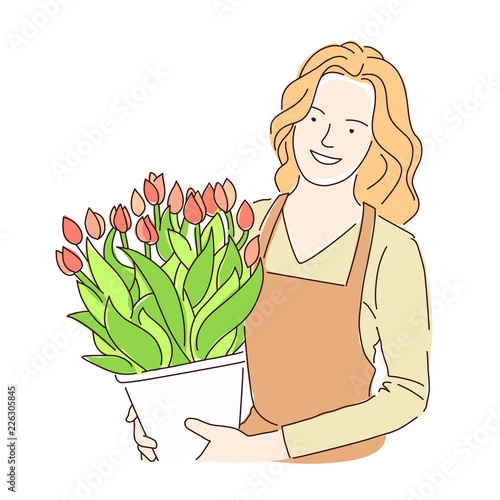 Florist girl with a pot of beautiful flowers tulips