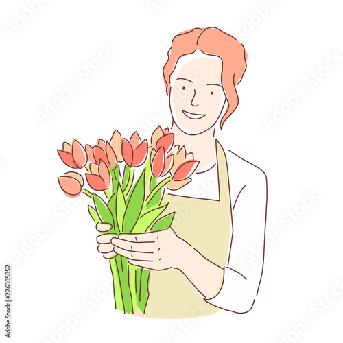 Florist girl with a bouquet of beautiful flowers of tulips