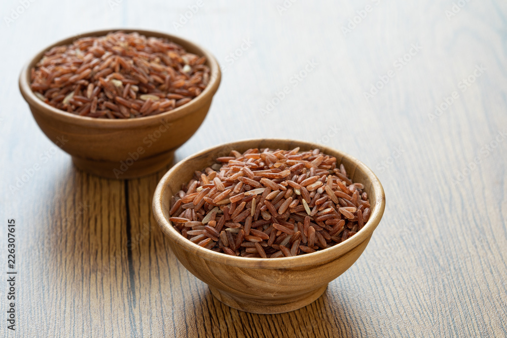 brown rice for healthy wood bowl on wood background brown rice for healthy wood bowl on wood background