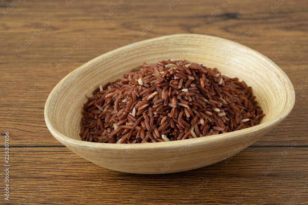 brown rice for healthy wood bowl on wood background brown rice for healthy wood bowl on wood background