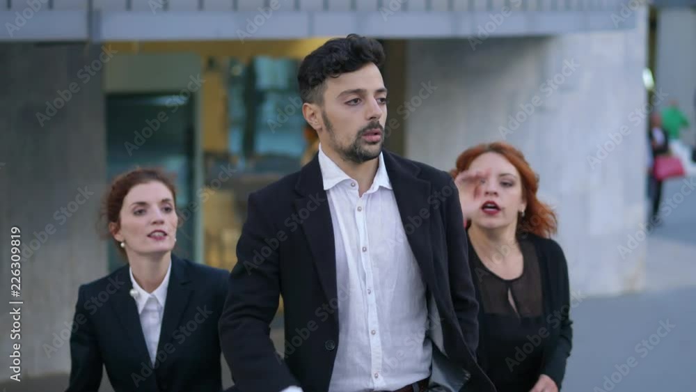 Quarrel among group of business people.Competition, man against woman - outdoor Quarrel among group of business people.Competition, man against woman - outdoor