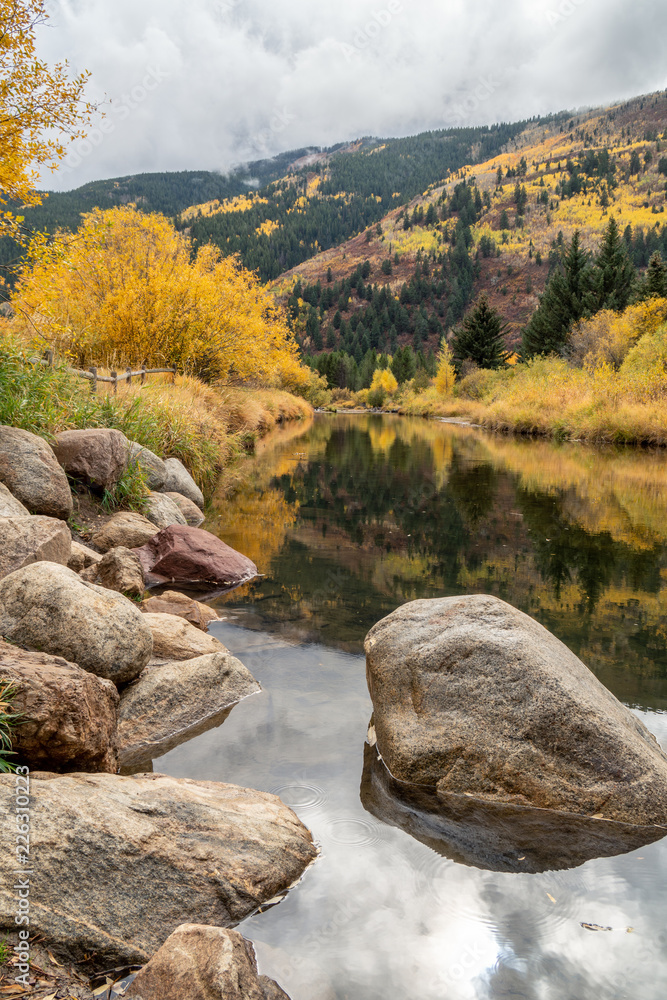 Fall color and reflection on the Roaring River, Aspen, Colorado Fall color and reflection on the Roaring River, Aspen, Colorado
