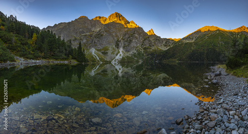 Panorama of a mountain lake during sunrise - Morskie Oko, Tatra Mountains, Poland