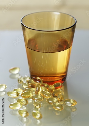 Evening primrose oil capsules and water photo