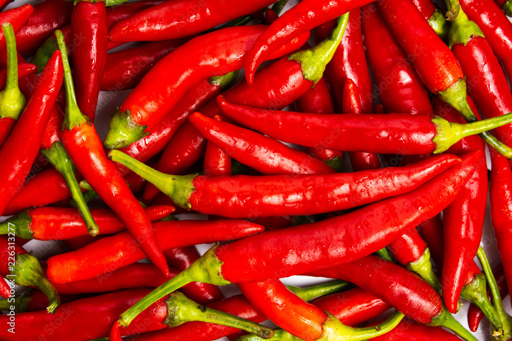 Thin red peppers on a pile