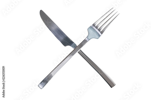 Crossed silver shiny fork and knife. Isolated white background. Time to break concept design. Copy space photo