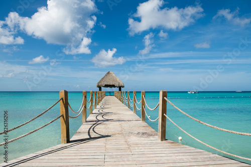 Beautiful gazebo in Caribbean sea with tuquoise water and blue sky