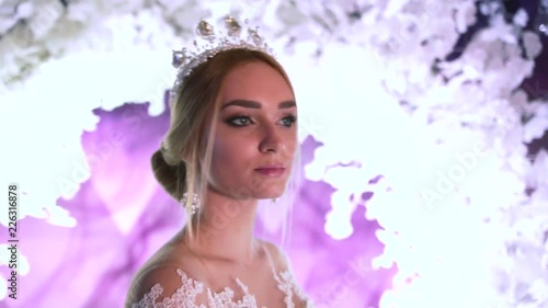 girl demonstrates the image of the bride at a wedding exhibition