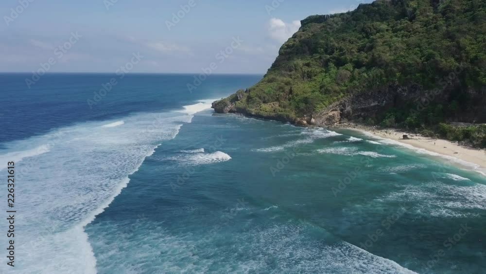 Aerial shot of ocean waves crashing coastline cliff Aerial shot of ocean waves crashing coastline cliff