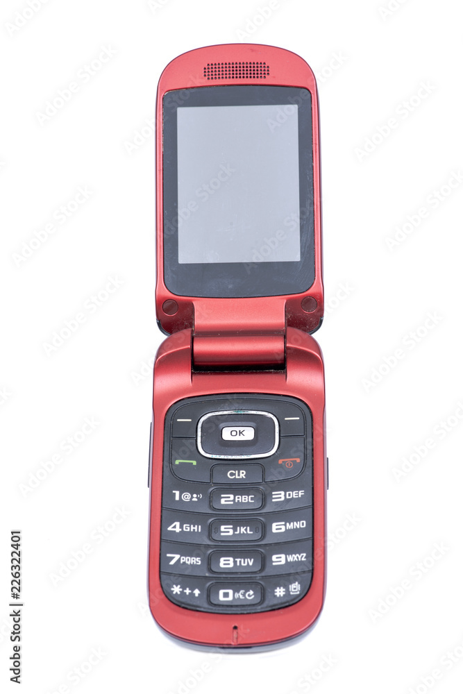 Old used flip cell phone isolated on white background Old used flip cell phone isolated on white background