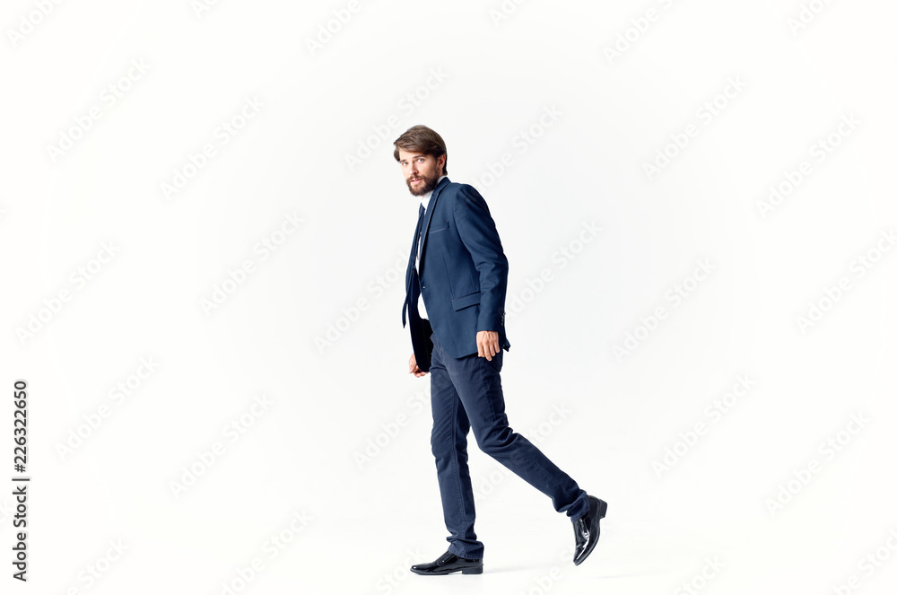 man in a suit on a light background side view man in a suit on a light background side view