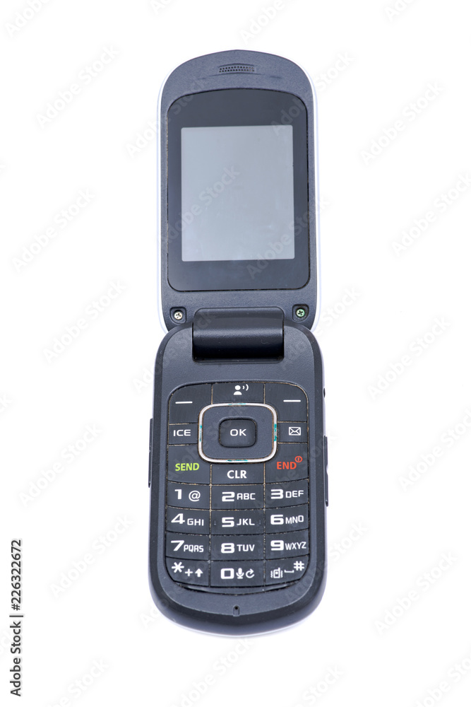 Old used flip cell phone isolated on white background Old used flip cell phone isolated on white background