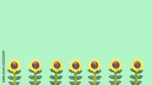 Fototapeta Naklejka Na Ścianę i Meble -  Line of Sunflowers Model on Color Green Background