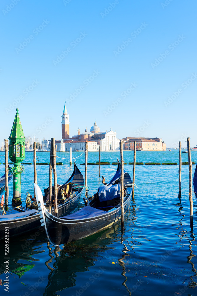 view of San Giorgio island with Gondola boats, Venice Italy