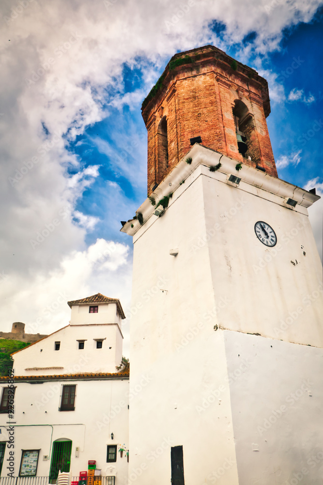 Bell Tower of the Old Church of Santa María la Coronada, located in the Plaza de la Constitución of the picturesque town of Jimena de la Frontera, in the province of Cadiz, southern Spain