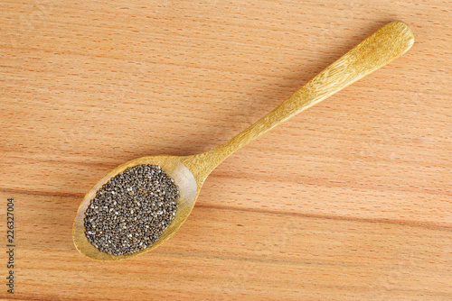 Chia (cia) seeds in wooden spoon