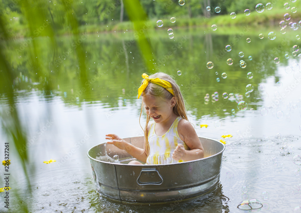 Little girl taking bath outside Stock Photo Adobe Stock