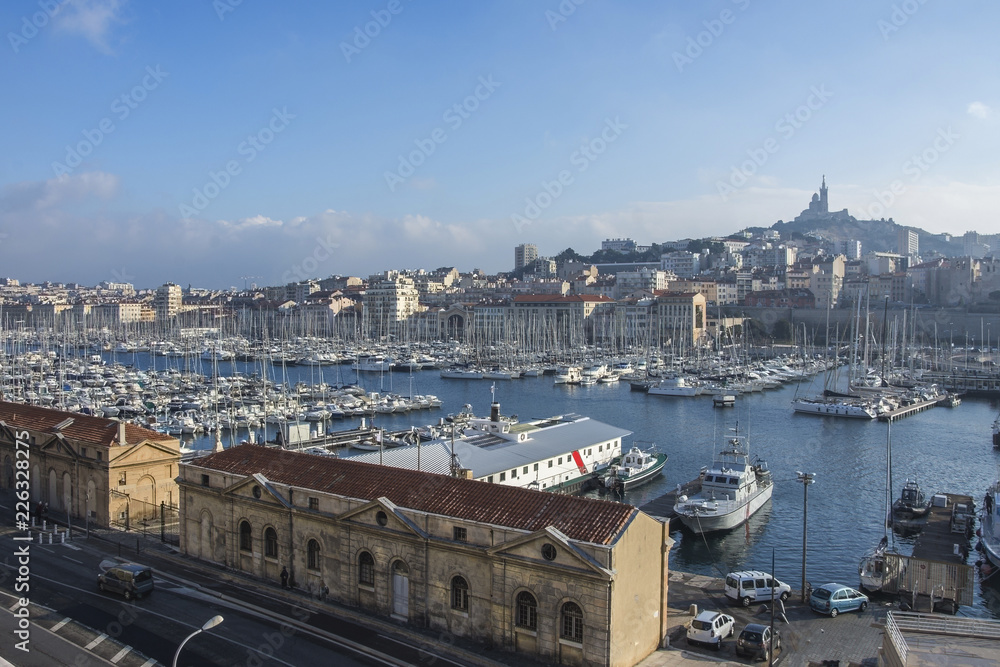 Aerial panoramic view on basilica of Notre Dame de la Garde and old port in Marseille, France