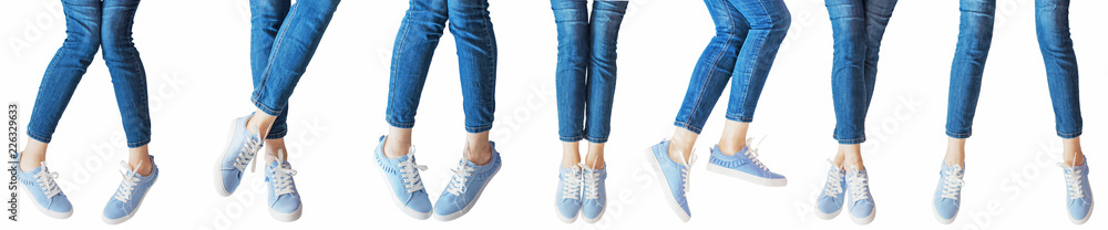 panorama set of female legs in the different poses in jeans and sneakers isolated on white background