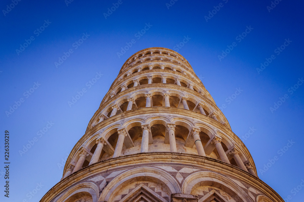 Leaning tower of Pisa with blue sky on the background