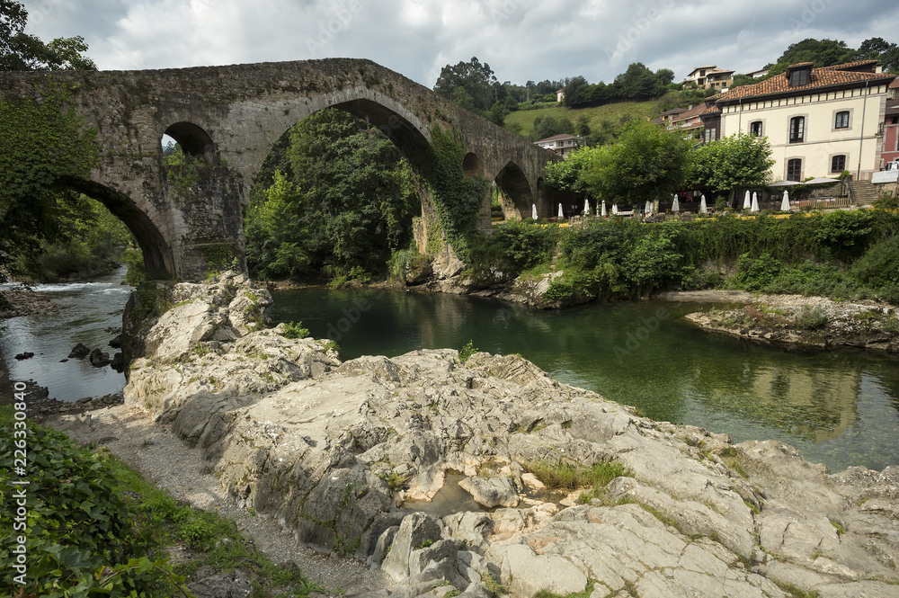 Cangas de Onis roman bridge on Sella river in Asturias of Spain.