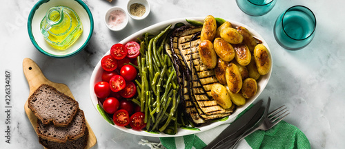 фотографія banner of a side dish of vegetables on the holiday table