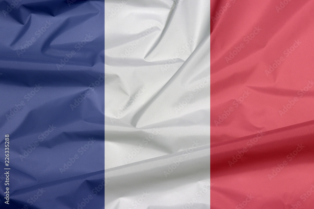 Fabric flag of France. Crease of French flag background, it is a vertical tricolor of blue white and red. Fabric flag of France. Crease of French flag background, it is a vertical tricolor of blue white and red.